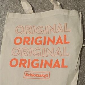 Schlotzsky's Canvas Tote Bag  and drink container with Orange Print